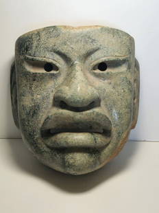 PRE-COLUMBIAN OLMEC JADE FUNERARY MASK: PRE-COLUMBIAN OLMEC JADE FUNERARY MASKMEASURAMENT: 7" HIGH, 6 1/2" WIDE, 4" DEEP1200BC-400BC