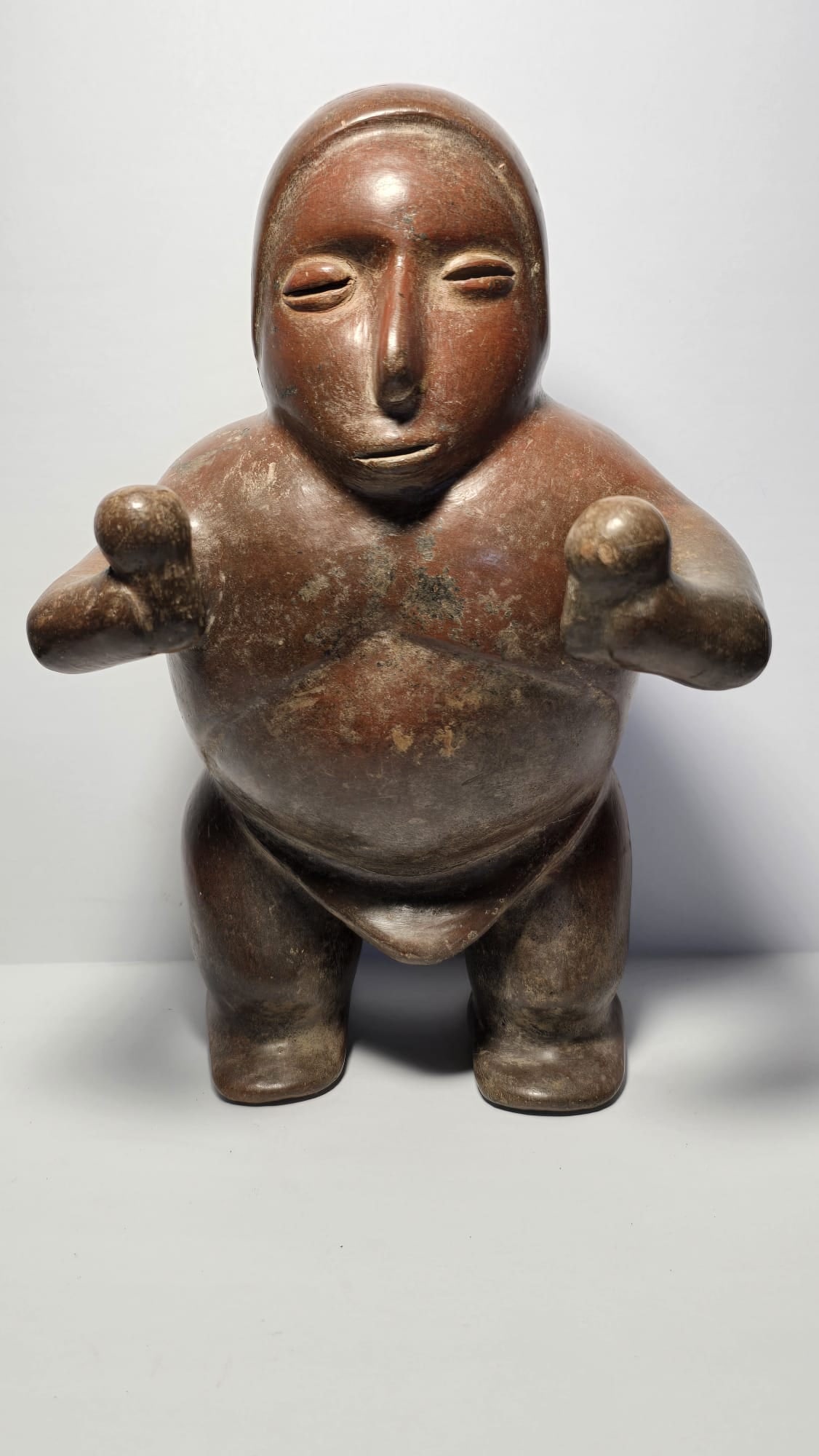 RARE PRE-COLUMBIAN COLIMA TERRACOTTA STANDING MUSICIAN FIGURE: RARE PRE-COLUMBIAN COLIMA TERRACOTTA STANDING MUSICIAN FIGUREA finely modeled terracotta standing musician figure from the Colima culture of West Mexico, dating from 100 BC to 250 AD. The sculpture re