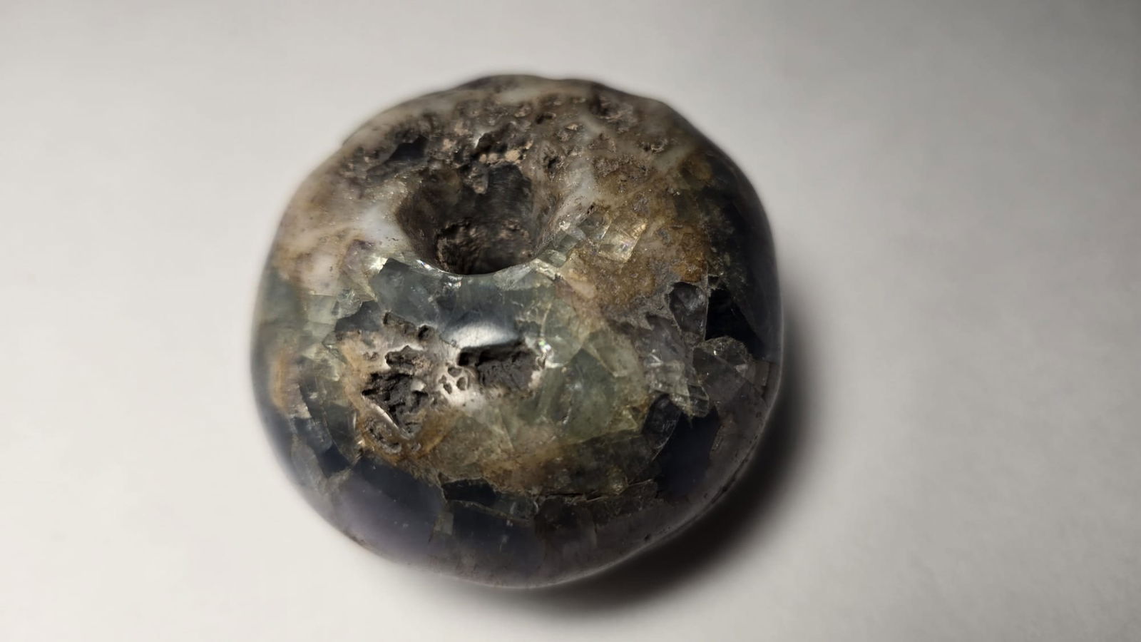 PRE-COLUMBIAN MAYAN FLUORITE NECKLACE BEAD: PRE-COLUMBIAN MAYAN FLUORITE NECKLACE BEADA finely carved fluorite necklace bead from the Mayan culture, dating from 700 AD to 1200 AD. Fluorite was a valued and uncommon material in Mesoamerica, asso