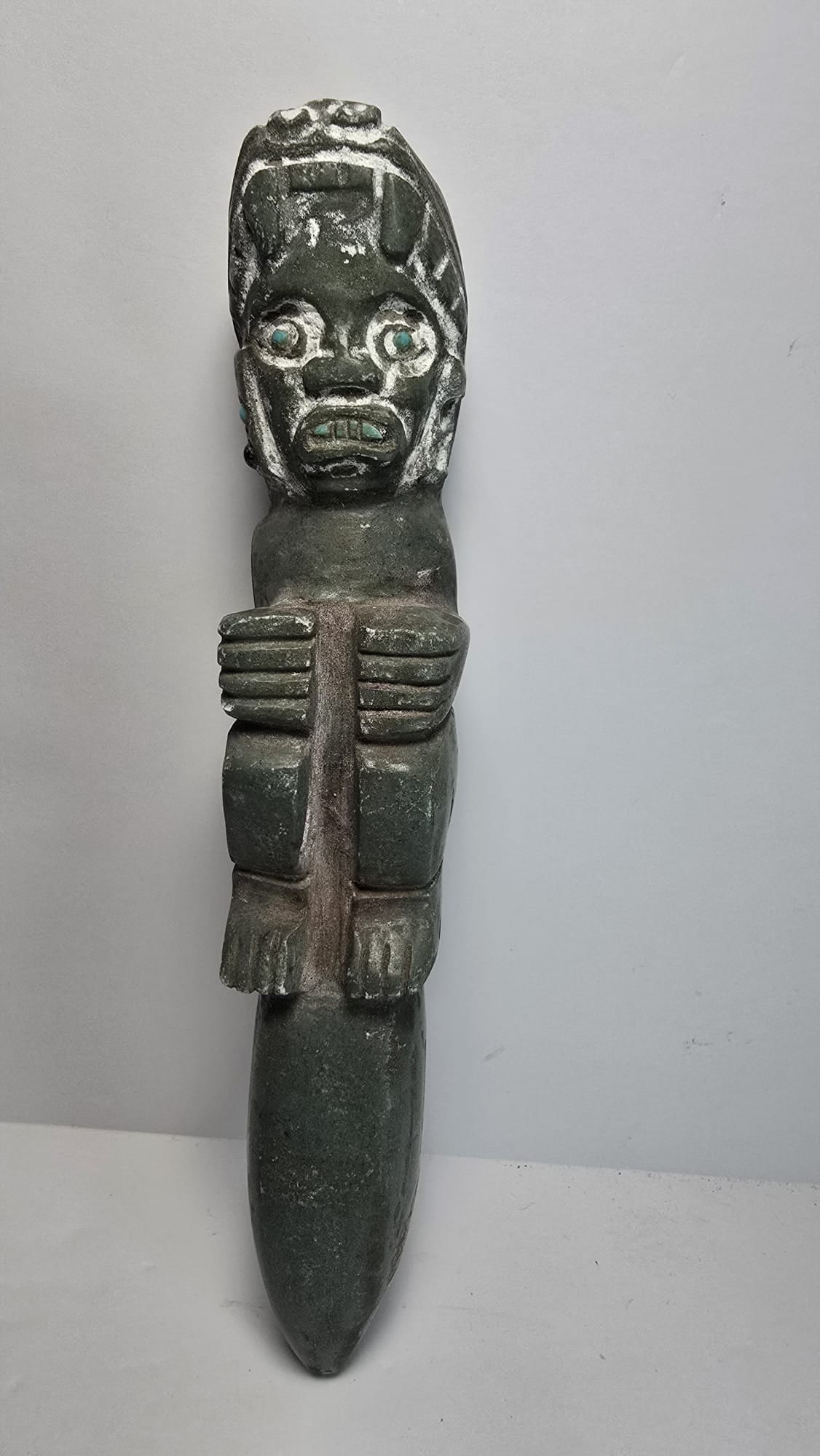PRE-COLUMBIAN TOLTEC JADE FUNERARY ORNAMENT (DAGGER FORM): PRE-COLUMBIAN TOLTEC JADE FUNERARY ORNAMENT (DAGGER FORM)A finely carved jade funerary ornament from the Toltec culture, dating from 700 AD to 1200 AD. Ornaments of this type, often described as dagge