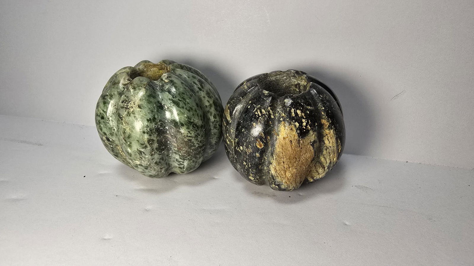 PRE-COLUMBIAN MAYAN JADE SQUASH PENDANT BEADS: PRE-COLUMBIAN MAYAN JADE SQUASH PENDANT BEADSFine pair of Mayan jade squash-form pendant beads, dating approximately 700 AD – 1200 AD (Late Classic to Early Postclassic period). Jade was the most pr