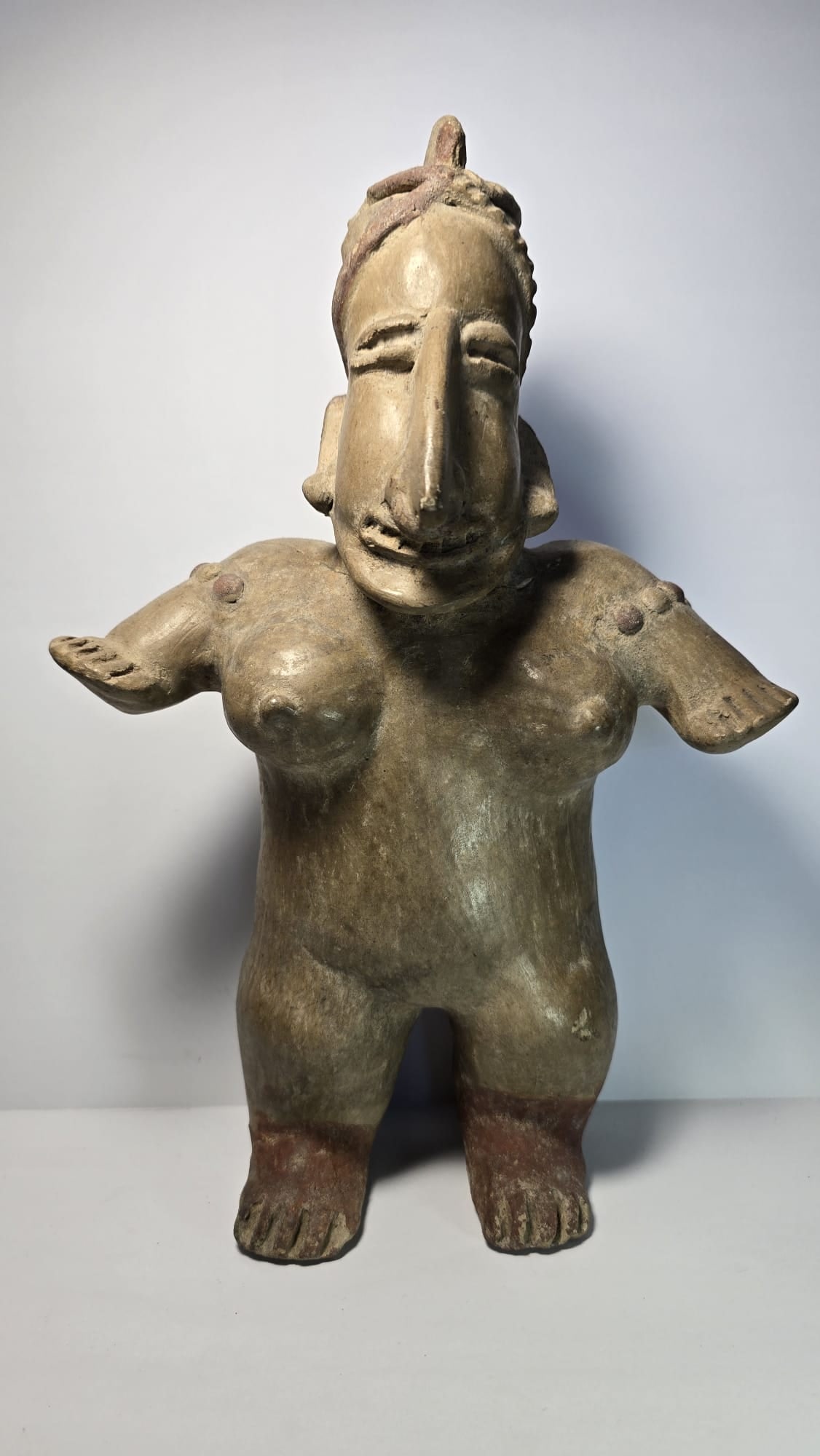PRE-COLUMBIAN AMECA TERRACOTTA STANDING WOMAN FIGURE: PRE-COLUMBIAN AMECA TERRACOTTA STANDING WOMAN FIGUREPre-Columbian Ameca culture terracotta standing female figure, dating approximately 100 BC – 250 AD (Late Formative to Early Classic period). Scul
