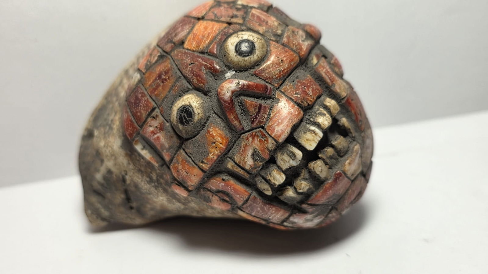 PRE-COLUMBIAN MAYAN PECTORAL PENDANT SNAIL WITH SPONDYLUS AND BONE INLA: PRE-COLUMBIAN MAYAN PECTORAL PENDANT SNAIL WITH SPONDYLUS AND BONE INLAYPre-Columbian Mayan pectoral pendant carved in the form of a ceremonial snail, dating approximately 700 AD – 1200 AD (Late Cla