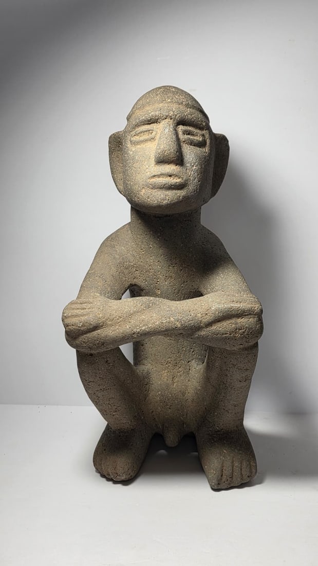 PRE-COLUMBIAN COSTA RICAN BASALT STONE SEATED FIGURE: PRE-COLUMBIAN COSTA RICAN BASALT STONE SEATED FIGUREPre-Columbian Costa Rican seated figure carved from basalt stone, dating approximately 400 AD – 800 AD (Middle to Late Period). Stone sculptures o
