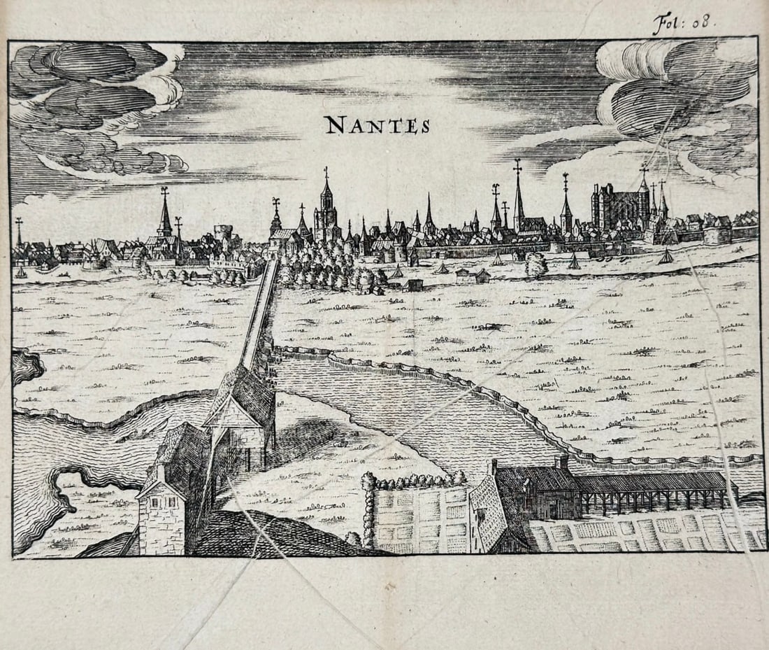 Melchior Tavernier – View of Nantes, France – From the Muscadet Wine Region – Engraving: This antique engraving presents a panoramic view of the French city of Nantes, situated along the Loire River and historically significant as the capital of Brittany. The image shows a detailed render