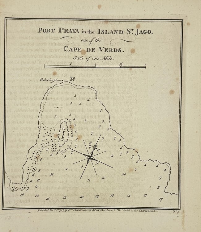 James Cook – Port Praya, Island of St. Jago (Cape Verde) – Original Copperplate Map: This original copperplate engraving shows Port Praya on the island of St. Jago (Santiago), one of the Cape Verde Islands off the West African coast. The map features coastal contours, soundings in fat
