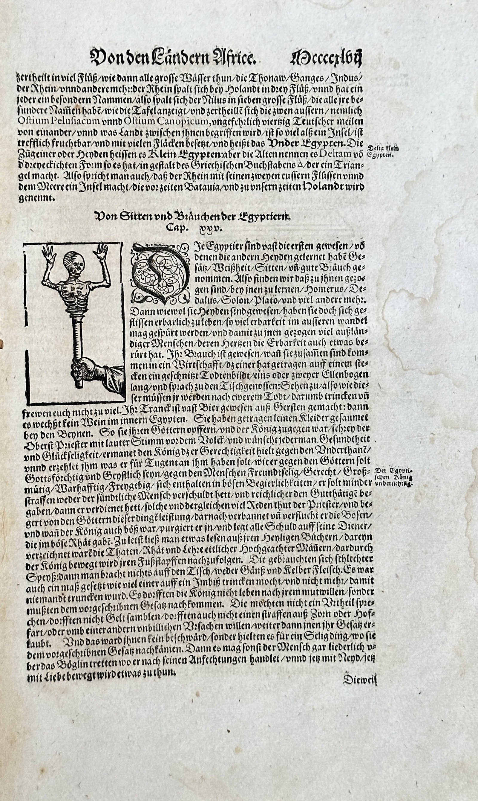 Sebastian Münster (1489-1552) – On the African Countries – Woodcut (1550): This sheet is from Sebastian Münster’s "Cosmographia," a significant work in the history of geography and science. The page features a block of German text and a woodcut illustration depicting a sk