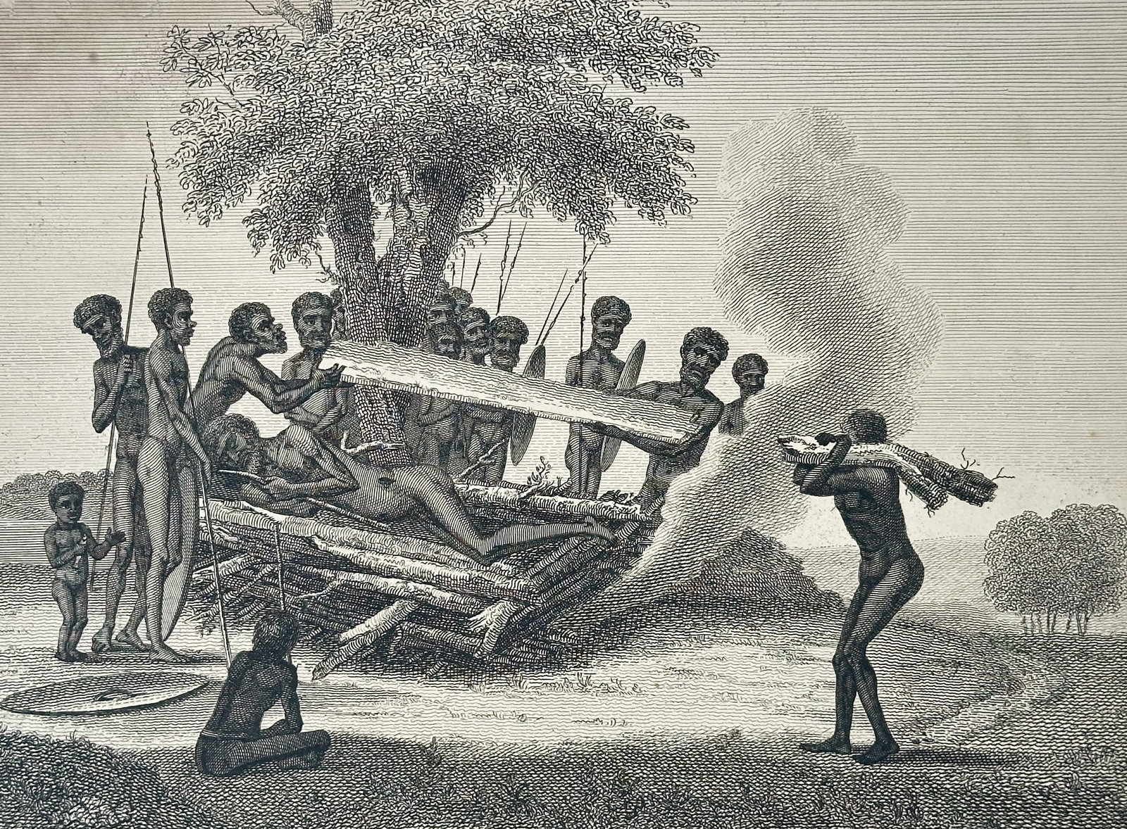 Thomas Davies (fl. 1765–1790), after – Burning a Corpse – Engraving (1804): This Engraving is a detailed ethnographic illustration documenting a funerary ritual. The print is titled Burning a Corpse and depicts a scene in the Australian landscape where several indigenous figu
