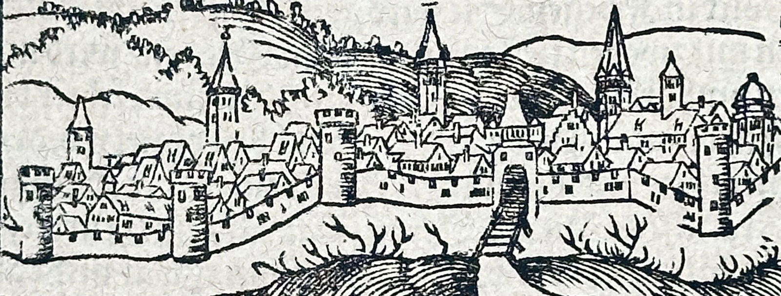 Sebastian Münster – City View of Mantua (and Artemisium Text) from Cosmographia – Woodcut: This folio leaf is a print from the influential work Cosmographia, featuring German text from the section Von Italia (Of Italy). The page includes a woodcut city view labeled Mantuæ, depicting a wall