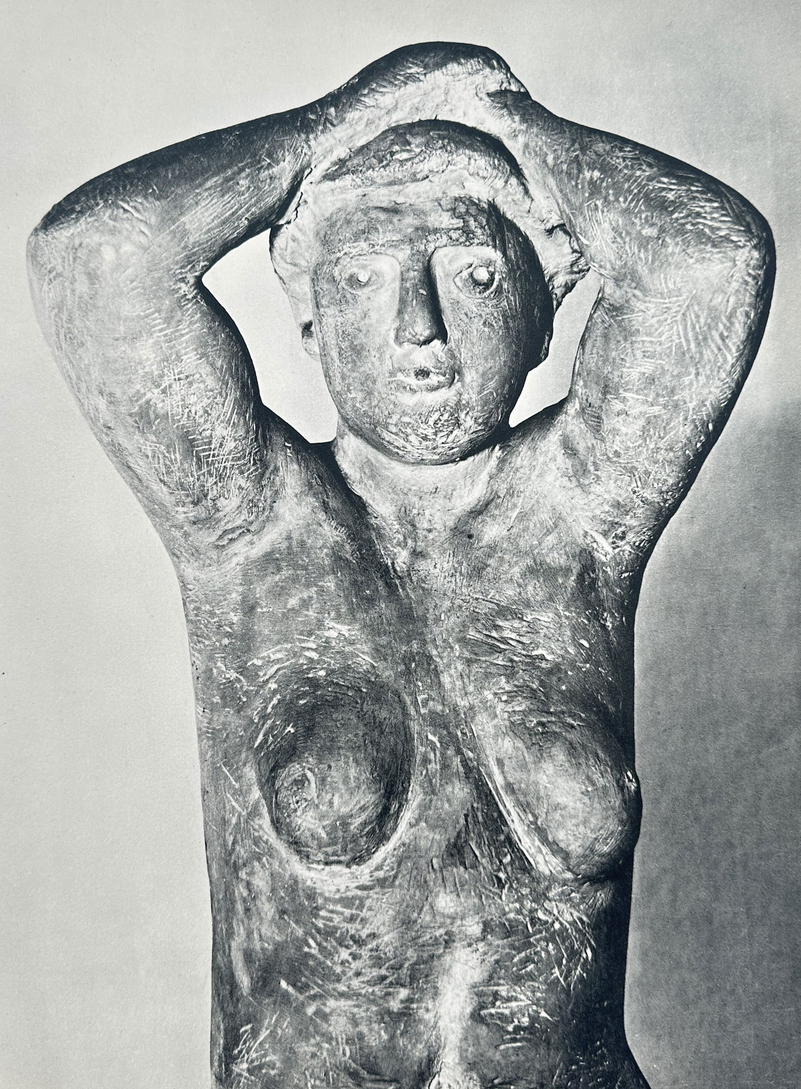 Marino Marini (1901–1980) – Pomona – Halftone Print (20th Century): This halftone print is a black and white reproduction of one of Marino Marini's famous Pomona sculptures, which are stylized depictions of the female nude. The sculpture shows a robust, textured figur