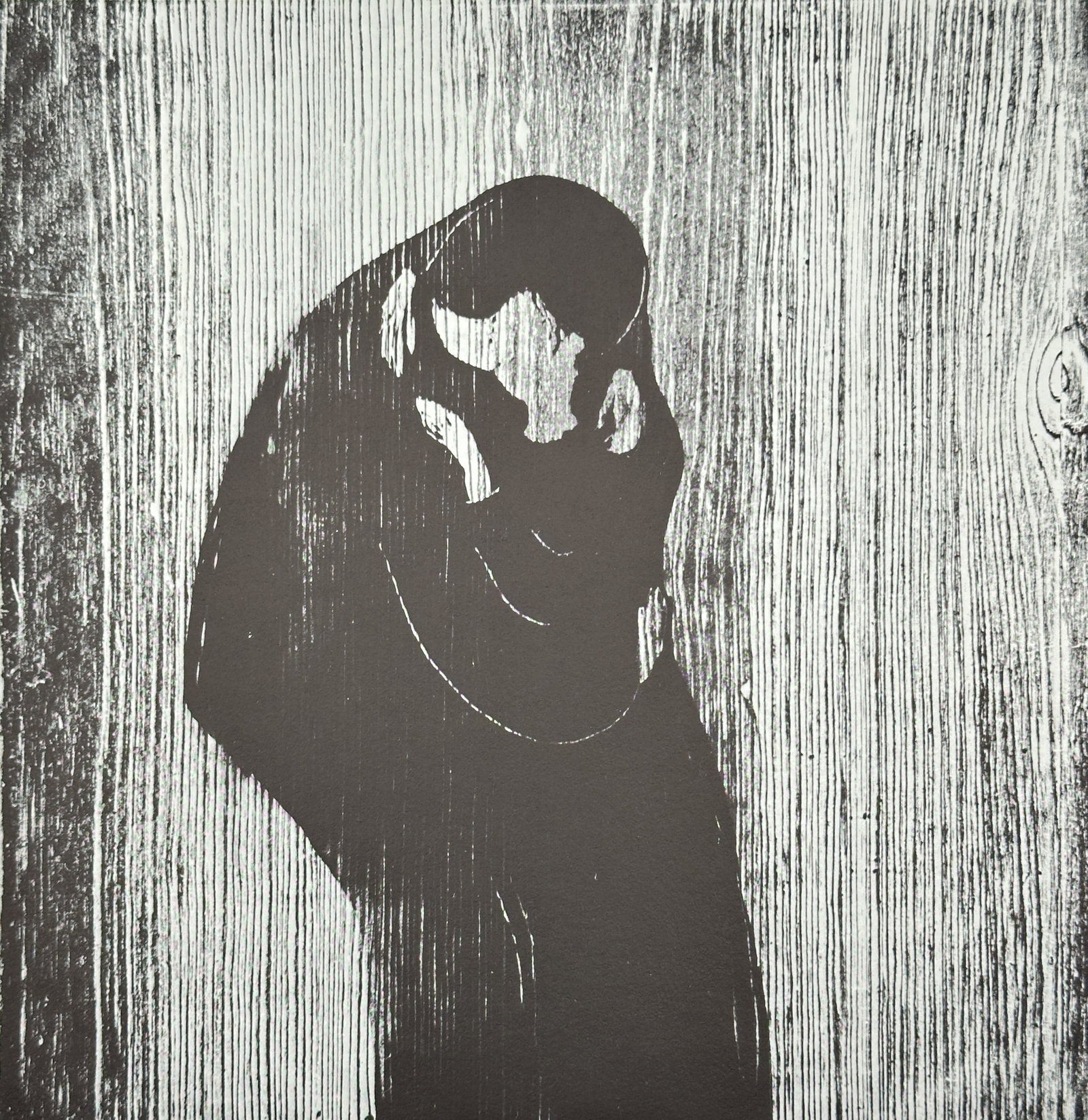 Edvard Munch (1863–1944) – Kysset. Mandshode i kvindehår (The Kiss. Man's Head in Woman's Hair): This offset print is a black and white illustration of Edvard Munch's profound woodcut, Kysset (The Kiss), originally created in 1897. The image depicts two figures in a tight embrace, their faces mer