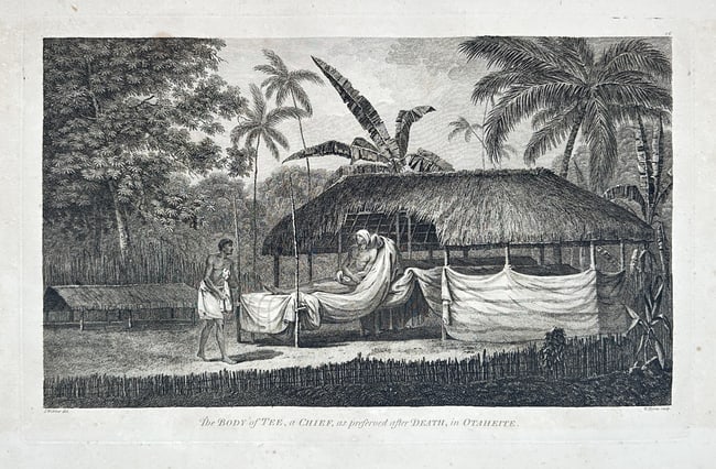 John Webber – The Body of Tee, a Chief, as preserved after Death, in Otaheite: This remarkable ethnographic scene depicts the preserved body of Chief Tee of Otaheite (modern Tahiti), laid out on an elevated funeral platform (tupapau) within a traditional open-sided shelter. The