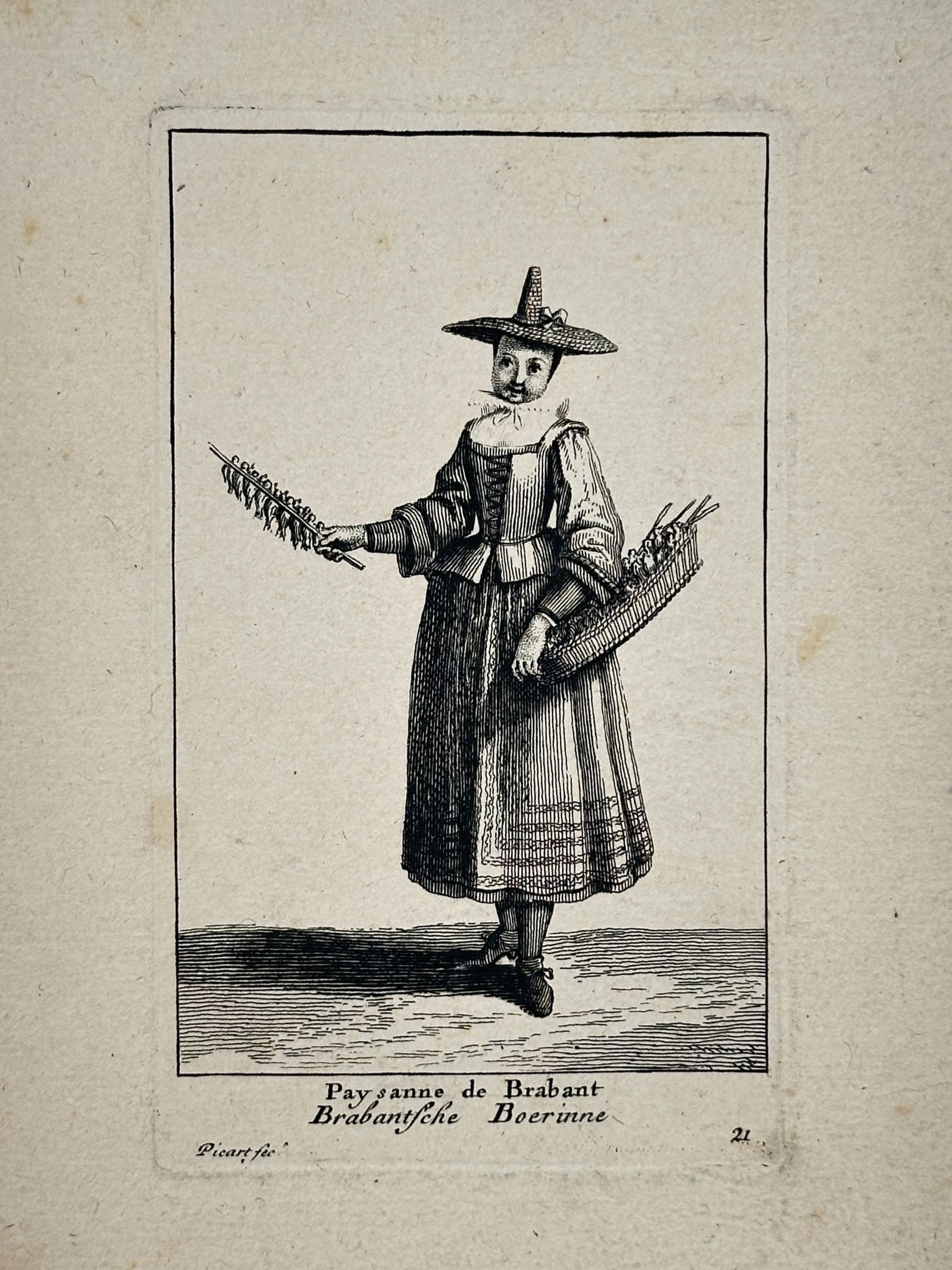 Bernard Picart (1673–1733) – Brabant Peasant Woman – Engraving (1728): This illustration depicts a woman from the Brabant region dressed in traditional eighteenth-century attire, characterized by a long, pleated skirt, a laced bodice, and a broad-brimmed hat with a point