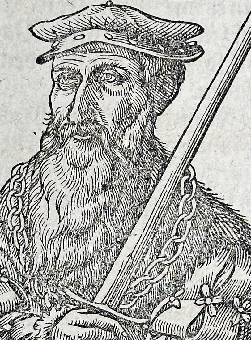 Sebastian Münster (1488–1552) – Portrait of a Nobleman – Woodcut (1550): This woodcut depicts a bearded nobleman in historical attire holding a sword, appearing as an illustration within a leaf of the Cosmographia. The page includes German Gothic text discussing the histor
