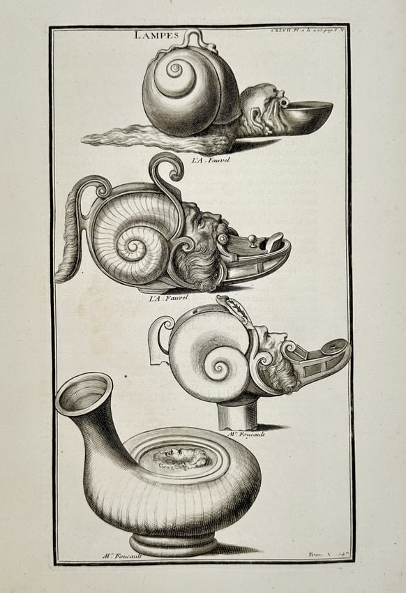 Bernard de Montfaucon (1655-1741) – View of Ancient Lamps – Engraving (1719–1724): Lampes depicts a collection of four ancient ceramic lamps, each featuring intricate sculptural details such as human faces and spiral shell motifs. This work serves as a cataloged illustration for the