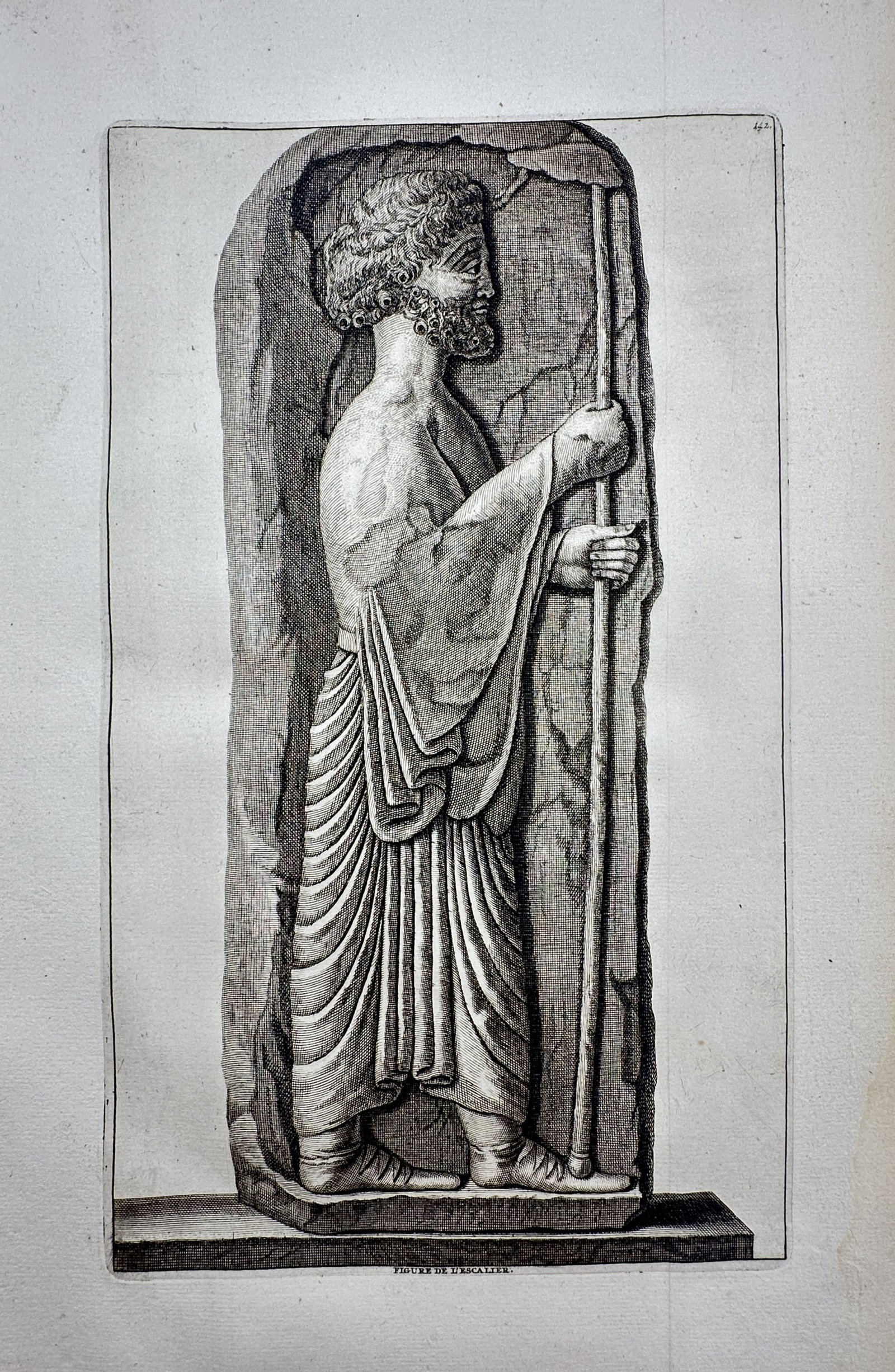 Cornelis de Bruijn (1652–1727) – View of a Figure from a Staircase Relief – Copper engraving: "Figure de l'Escalier" This archaeological print illustrates a low-relief sculpture of a bearded figure in profile, holding a long staff and dressed in traditional Persian robes, as found on the monum