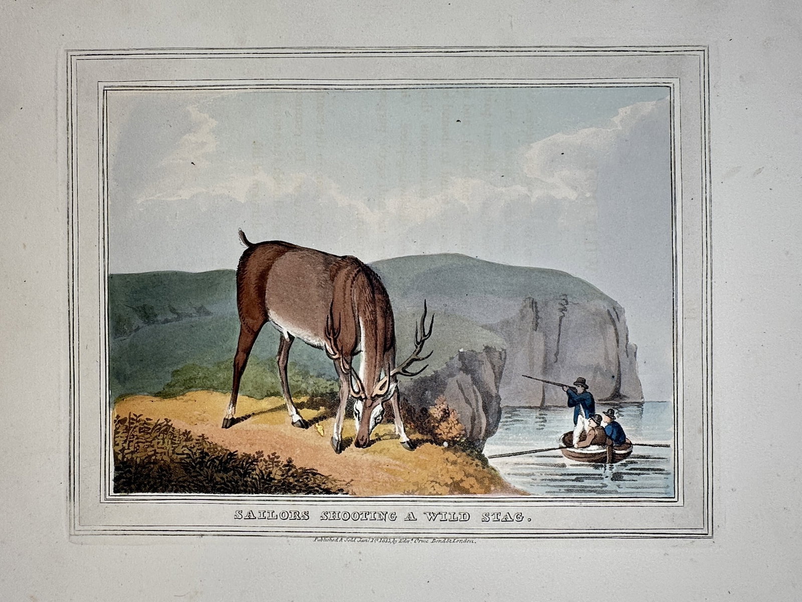 John Heaviside Clark (1771–1863) – View of Sailors Shooting a Wild Stag – Hand-coloured: "Sailors Shooting a Wild Stag" This sporting print depicts a large stag grazing on a coastal cliffside while a group of sailors in a small rowing boat aim a musket at the animal from the water below. 