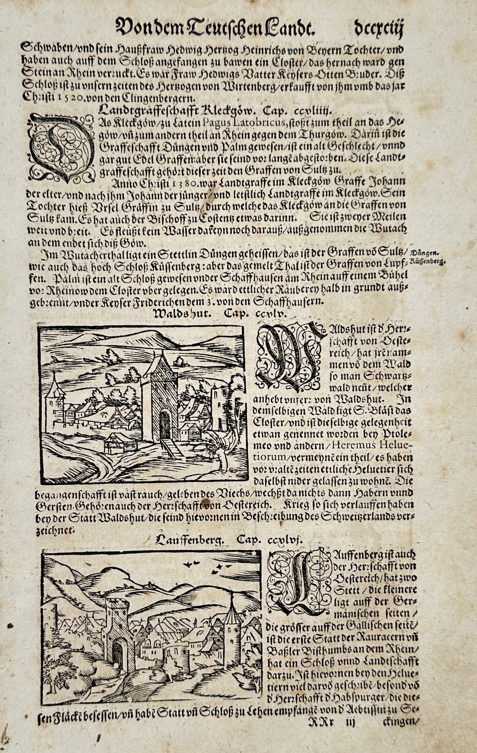 Sebastian Münster (1488-1552) – View of Waldshut and Laufenberg – Woodcut (c. 1544-1570): "Vondem Teuschen Landt" is a page from a descriptive text on regional history and geography, featuring two inset woodcut townscapes of Waldshut and Laufenberg. This text is from the Cosmographia, an e
