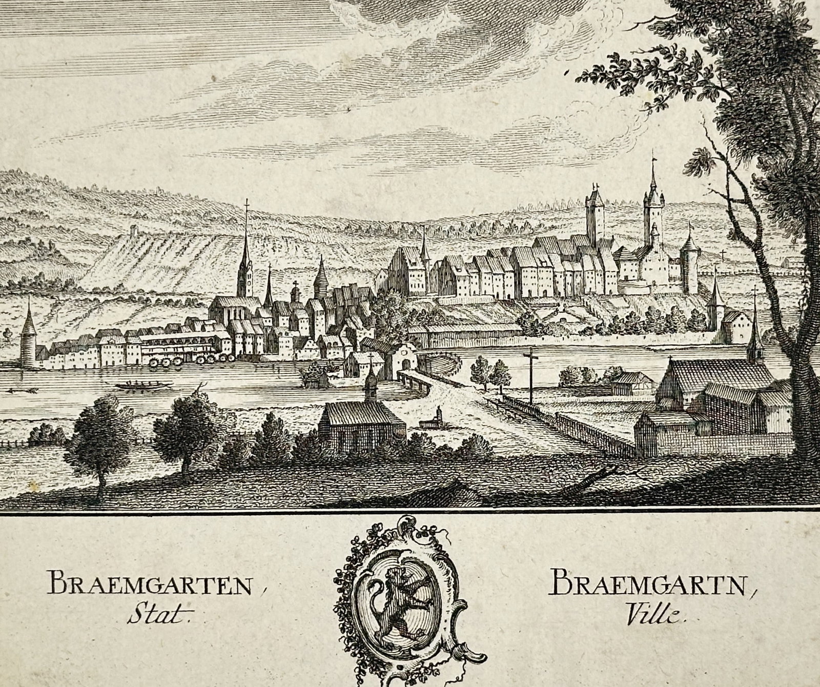 David Herrliberger – Town of Bremgarten – Engraving (18th Century): Bremgarten Town The artwork displays a panoramic cityscape featuring buildings, church spires, and fortified walls along a river bank with rolling hills behind. The composition focuses on topographica