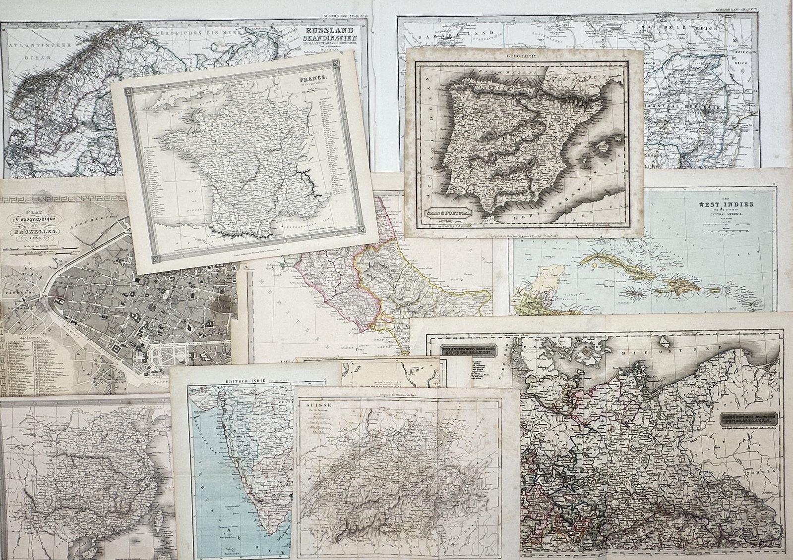 Different Authors – Set of 12: Vintage Regional Cartography (France, Spain) – Engravings: "Vintage Regional Cartography" depicts a broad overview of various geographical regions including France, Spain and Portugal, the West Indies, and European city plans across multiple historical docume