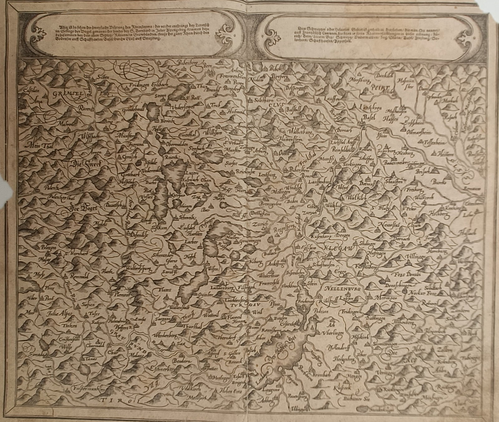 Sebastian Münster – Map of Switzerland – Europe – Woodcut (16th Century): "Map of the Swiss Confederation and Neighboring Lands" presents an early cartographic survey depicting the mountainous topography, river systems, and regional settlements of historical Switzerland. Th