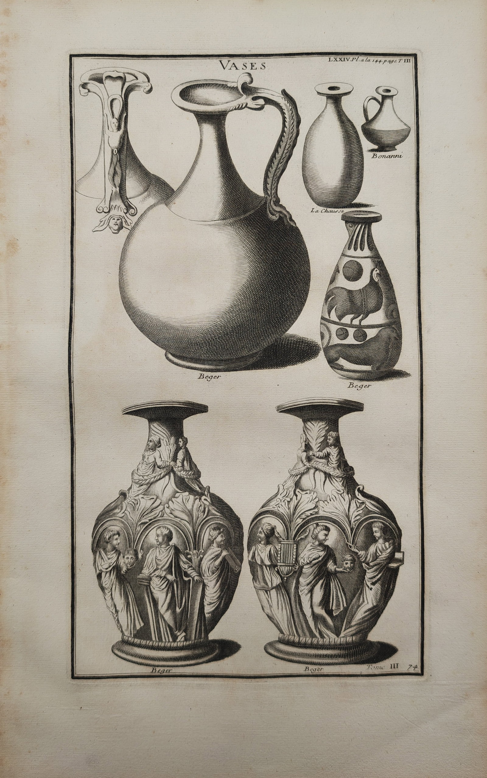 Bernard de Montfaucon – Classical and Antique Vases – Engraving (18th Century): "Vases" presents an archaeological study illustrating a diverse assortment of classical and antique vessels, including sculpted urns adorned with figurative reliefs alongside decorated ceramic jugs an