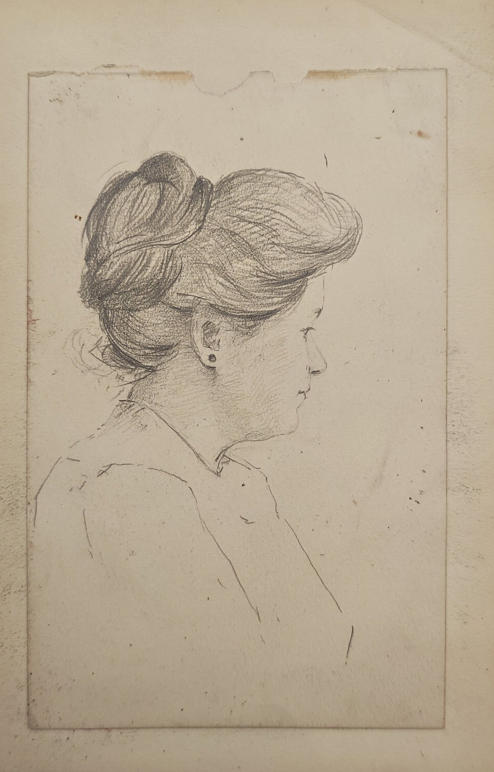 Unknown Artist – Profile Portrait of a Woman – Drawing (20th Century): "Profile Portrait of a Woman" presents a delicate pencil sketch depicting the side profile of a young woman with her hair styled in an elegant updo. The intimate bust portrait emphasizes soft linear m