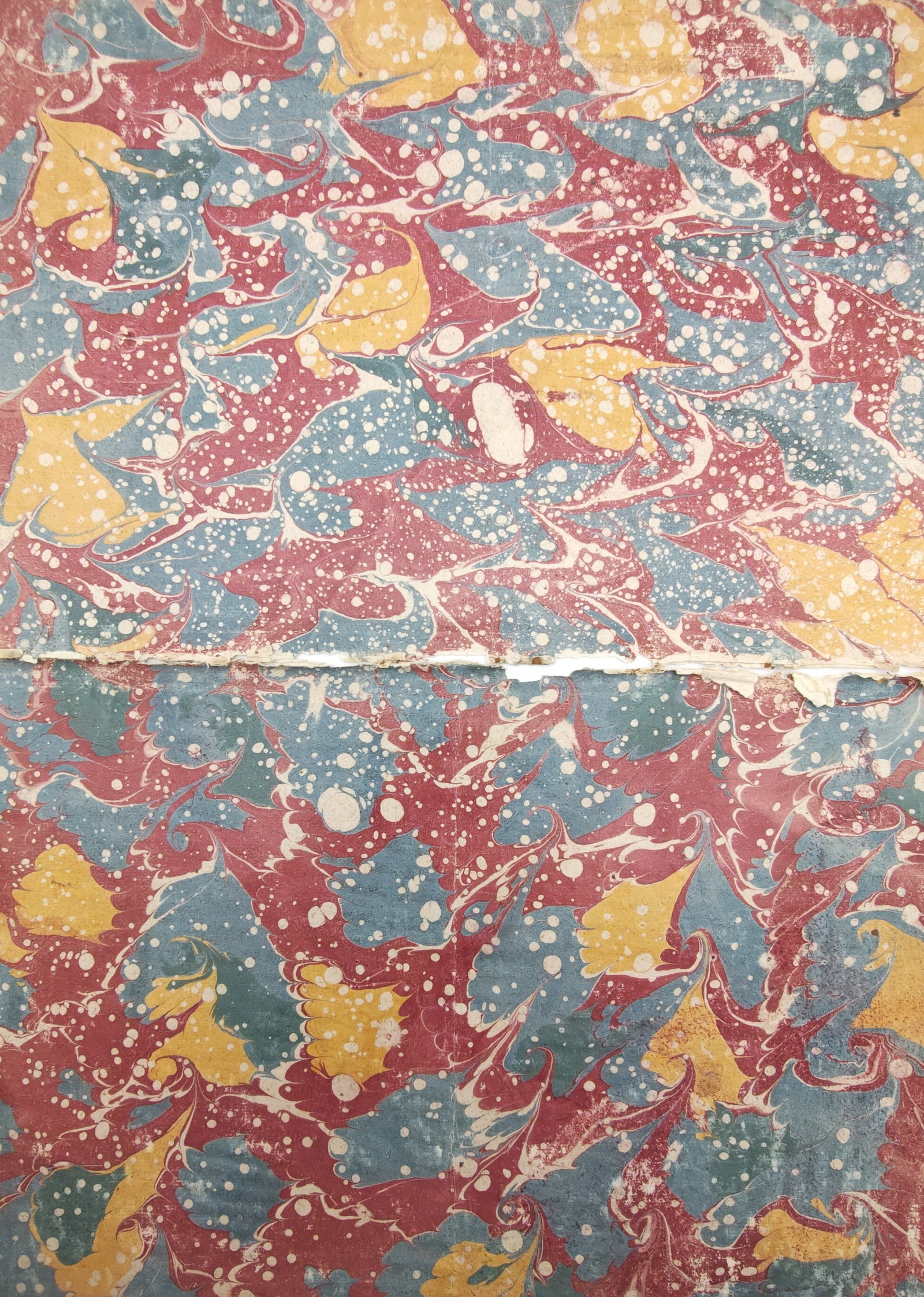 Unknown Artist – Set of 2: Antique Bouquet and Stone Marbled Bookbinding Endpapers: "Antique Bouquet and Stone Marbled Papers" presents a pair of decorative bookbinding endpapers featuring dynamic stylized swirls, droplet splatters, and organic botanical motifs in rich crimson, ochre