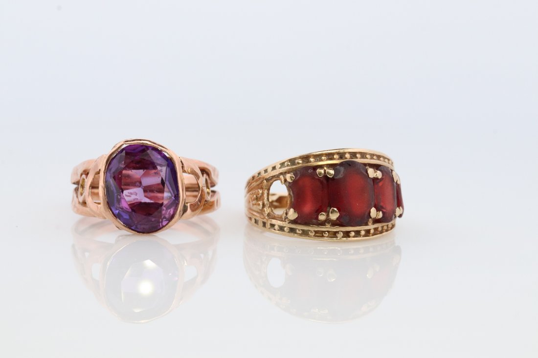 10k Ring Lot: 10k Gold Rings One is garnet missing one garnet. Size 6.5 Second is bezel set amethyst. Has dents. Size 7