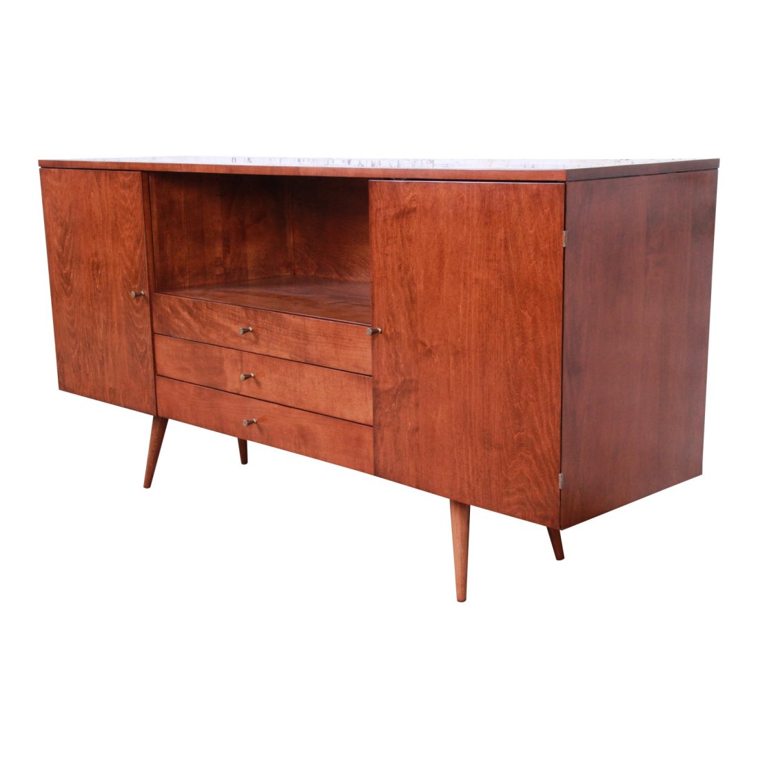 Paul McCobb Planner Group Mid-Century Modern Credenza or Media Cabinet, Newly Refinished: A rare and exceptional mid-century modern solid birch credenza or media cabinet Designed by Paul McCobb for his Planner Group line for Winchendon Furniture USA, 1950s Solid birch + iconic brass drawer