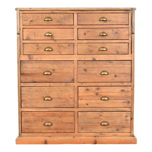 French Apothecary Style Rustic Pine Twelve-Drawer Chest of Drawers: A fantastic 12-drawer file cabinet or apothecary cabinet with fold down desk or work station Circa Late-20th Century Pine, with original brass hardware. Measures: 41.25"W x 18.75"D x 46"H. Desk height