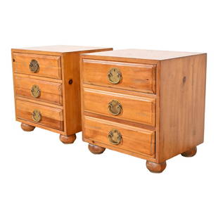Henredon Mid-Century Hollywood Regency Pine Bedside Chests, Pair: A gorgeous pair of mid-century modern Hollywood Regency three-drawer nightstands By Henredon USA, Circa 1970s Solid pine, with original Asian-inspired brass hardware. Measures: 23"W x 18.5"D x 24.5"H.