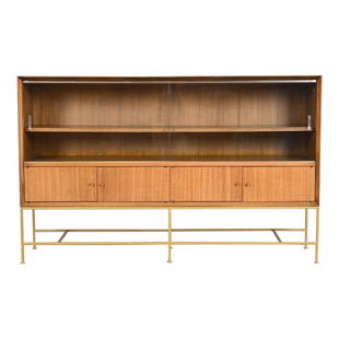 Paul McCobb Irwin Collection Mahogany and Brass Glass Front Bookcase or Bar Cabinet, 1950s: An exceptional Mid-Century Modern bookcase or bar cabinetBy Paul McCobb for Directional and produced by Calvin Furniture, "Irwin Collection"USA, 1950sGorgeous Honduran mahogany, with sliding glass