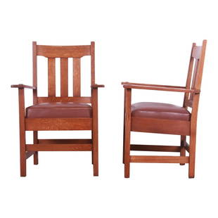 Stickley Brothers Mission Oak Arts & Crafts Arm Chairs, Pair: A rare and exceptional pair of Mission Arts & Crafts club chairs or dining armchairs By Stickley Brothers USA, Circa 1900 Solid quarter sawn oak frames, with leather upholstered seats. Measures: 26"W