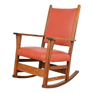 Gustav Stickley Arts & Crafts Oak and Leather Rocking Chair, Fully Restored: A gorgeous Mission oak Arts & Crafts rocking chair By Gustav Stickley USA, Circa 1900 Solid quarter sawn oak, with brass studded leather seat and back. Measures: 25.5"W x 28"D x 38"H. Seat height: 18"