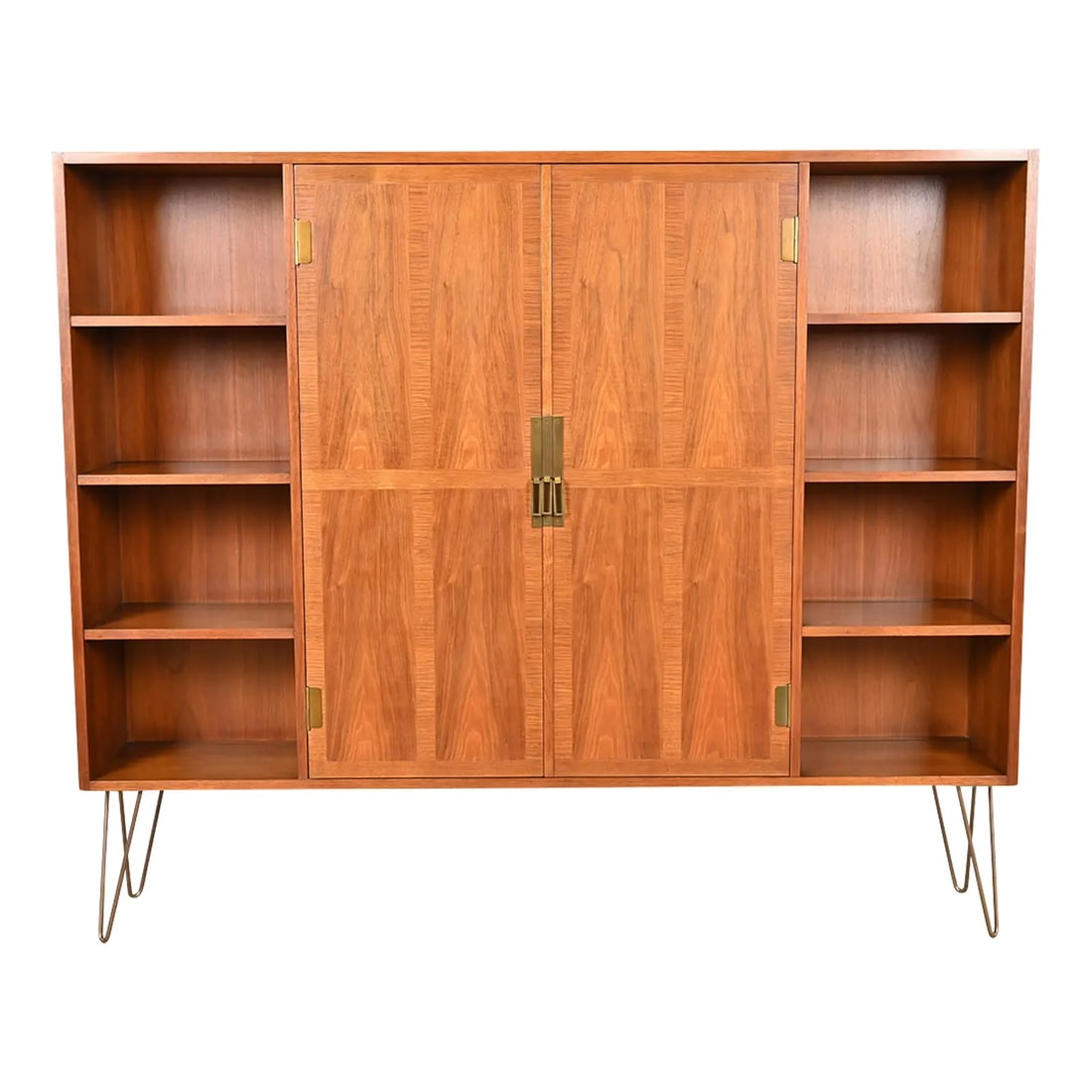Michael Taylor for Baker Furniture Mid-Century Modern Walnut Bookcase Cabinet, 1960s: A gorgeous Mid-Century Modern bookcase cabinet By Michael Taylor for Baker Furniture USA, 1960s Beautiful book-matched walnut, with brass hardware and brass-finished steel hairpin legs. Measures: 69.2