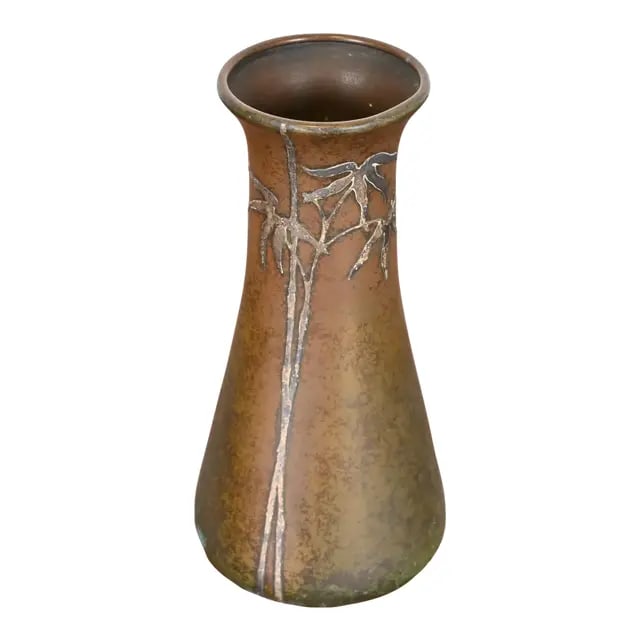 Heintz Arts & Crafts Sterling Silver on Bronze Vase: A beautiful Arts & Crafts period sterling silver on bronze vase with floral design By Heintz Art Metal Shop USA, Early 20th Century Sterling silver inlay on patinated bronze. Measures: 4"W x 4"D x 8.2