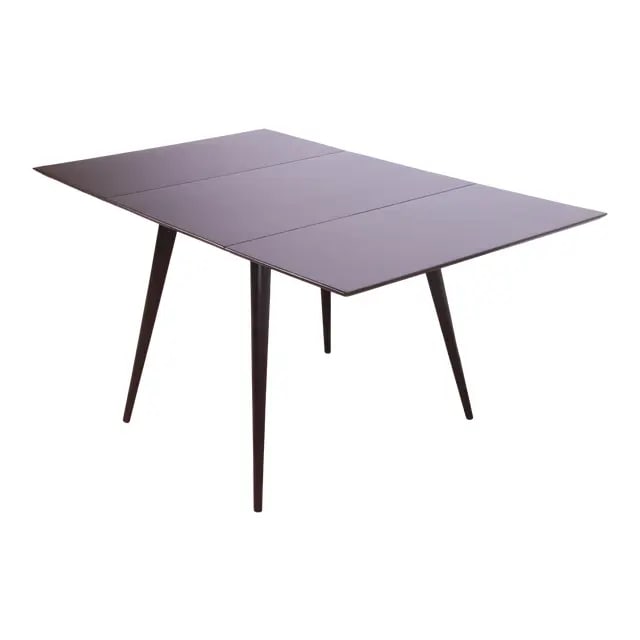 Paul McCobb Planner Group Black Lacquered Solid Maple Drop Leaf Dining Table, Newly Refinished: An exceptional mid-century modern black lacquered solid maple drop-leaf dining table By Paul McCobb for Winchendon Furniture, "Planner Group" USA, 1950s Measures: 56.25"W x 36"D x 29"H. With leaves do