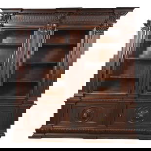 R. J. Horner Style Antique French Renaissance Revival Carved Mahogany Bookcase Cabinet, Circa 1900: An exceptional monumental antique Victorian or French Renaissance bookcase cabinet In the manner of R.J. Horner & Co. USA, Circa 1900 Mahogany, with ornate carved columns and faces, glass front doors,
