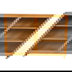 Edward Wormley for Dunbar Mid-Century Modern Mahogany Glass Front Bookcase, 1950s: A sleek and stylish Mid-Century Modern glass front bookcase or display cabinet By Edward Wormley for Dunbar Furniture USA, 1950s Bleached mahogany, with glass front doors and original brass hardware.