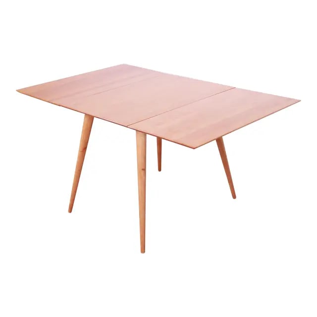 Paul McCobb Planner Group Solid Maple Drop Leaf Dining Table, Newly Refinished: A sleek and stylish mid-century modern solid maple drop-leaf dining table By Paul McCobb for Winchendon Furniture, "Planner Group" USA, 1950s Measures: 56.5"W x 36"D x 29"H. With leaves down, width is