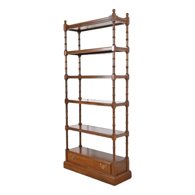 Ethan Allen Georgian Carved Cherry Wood Etagere or Bookcase: An exceptional Georgian or Regency style etagere, bookcase, or wall unit By Ethan Allen USA, Circa 1970s Gorgeous carved solid cherry wood, with bamboo form posts, and original brass hardware. Measure