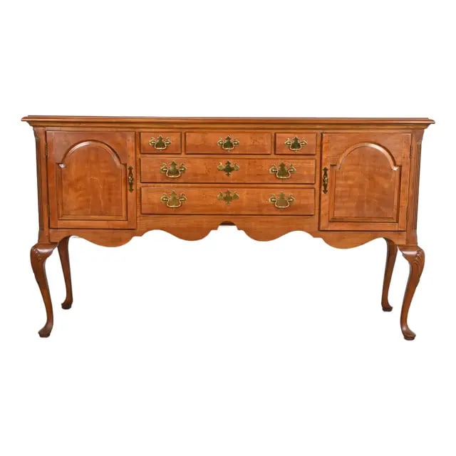 Henredon Queen Anne Solid Cherry Wood Sideboard Credenza: An exceptional Queen Anne or Chippendale style sideboard buffet, credenza, or console table By Henredon USA, Circa 1980s Solid carved cherry wood, with original brass hardware. Measures: 67"W x 19"D x