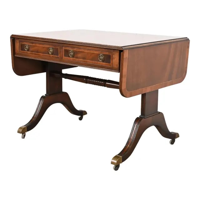 Baker Furniture English Regency Banded Mahogany Writing Desk or Console Table, Circa 1940s: An exceptional English Regency or Georgian style drop leaf writing desk, console table, or sofa table By Baker Furniture USA, Circa 1940s Mahogany, with English yew wood banding, satinwood string inla