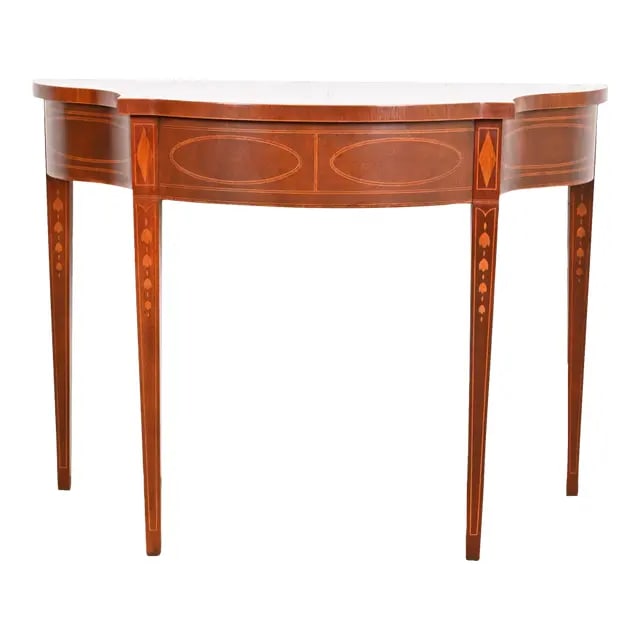 Baker Furniture Historic Charleston Federal Inlaid Mahogany Console or Entry Table: A gorgeous Federal or Hepplewhite style console or entry table By Baker Furniture, "Historic Charleston" Collection USA, Circa 1980s Mahogany, with inlaid satinwood marquetry. Measures: 39"W x 17"D x