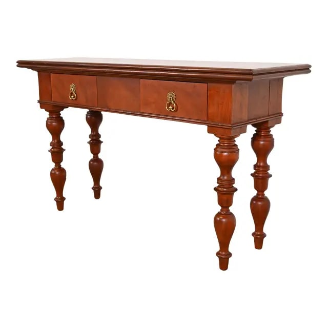 Baker Furniture Colonial West Indies Carved Mahogany Console Table: A gorgeous Colonial West Indies style console table By Baker Furniture, "Milling Road" Collection USA, 1990s Solid mahogany, with turned legs and original brass hardware. Measures: 56"W x 17.5"D x 32.