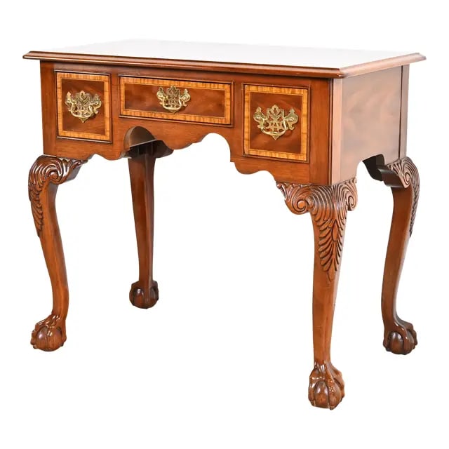 Councill Furniture Chippendale Banded Mahogany Lowboy Dressing Table or Entry Table: A gorgeous Chippendale style lowboy dresser, buffet server, or entry console table. By Councill Furniture USA, Circa 1980s Mahogany, with satinwood banding, original brass hardware, and carved solid m