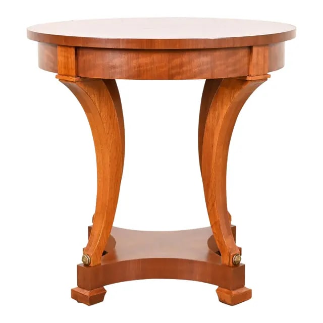 Henredon French Empire Carved Mahogany Tea Table or Center Table: An exceptional French Empire, Regency, or Biedermeier style tea table or center table By Henredon USA, Circa Late 20th Century Gorgeous carved mahogany, with ebony string inlay, and brass accents. Mea
