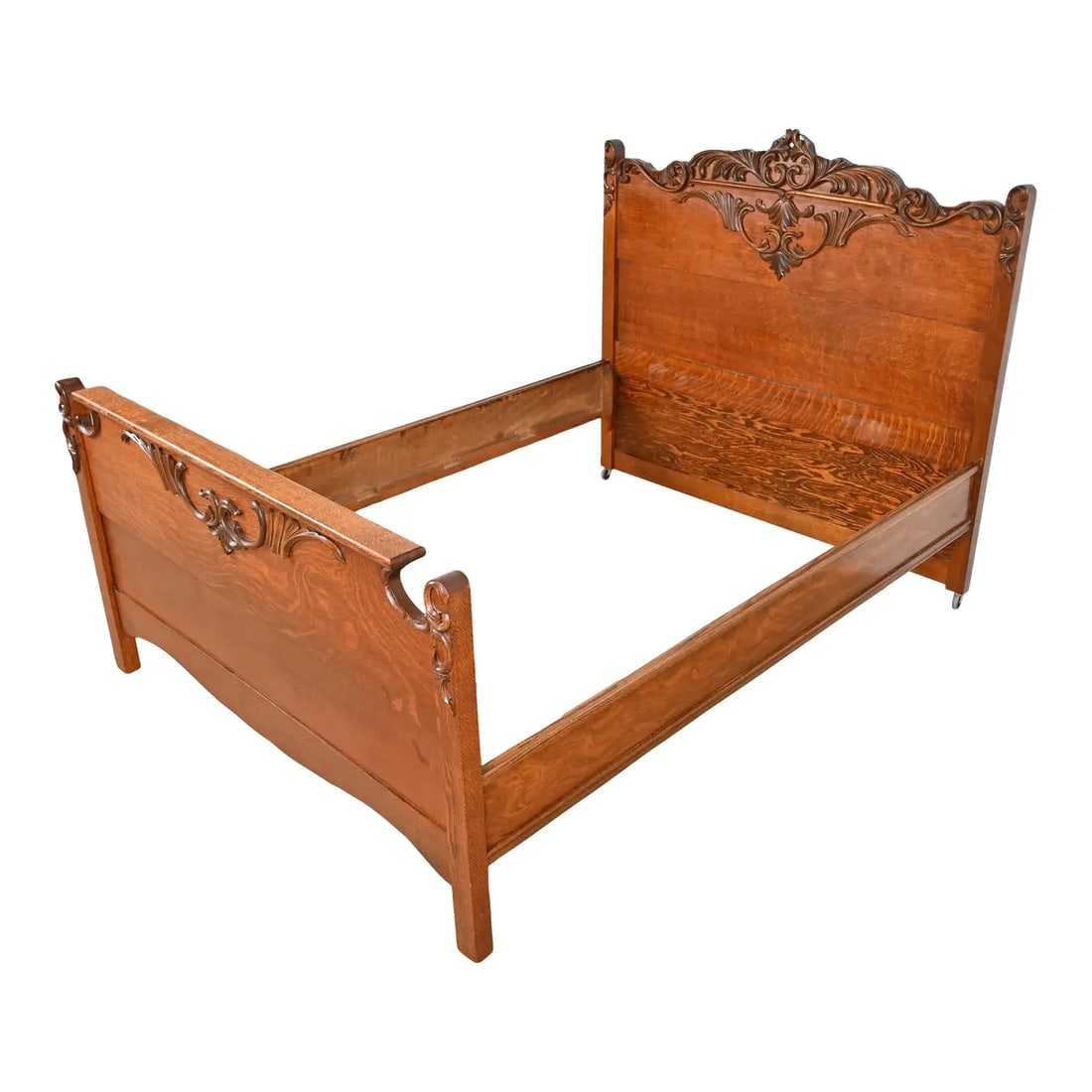 Antique Victorian Carved Oak Full Size Bed, Circa 1890s: A gorgeous antique Victorian carved oak full size bed frame USA, Circa 1890s Measures: 56.5"W x 77"D. Headboard: 50.5"H. Footboard: 31.75"H. Very good original vintage condition. Sturdy and ready for