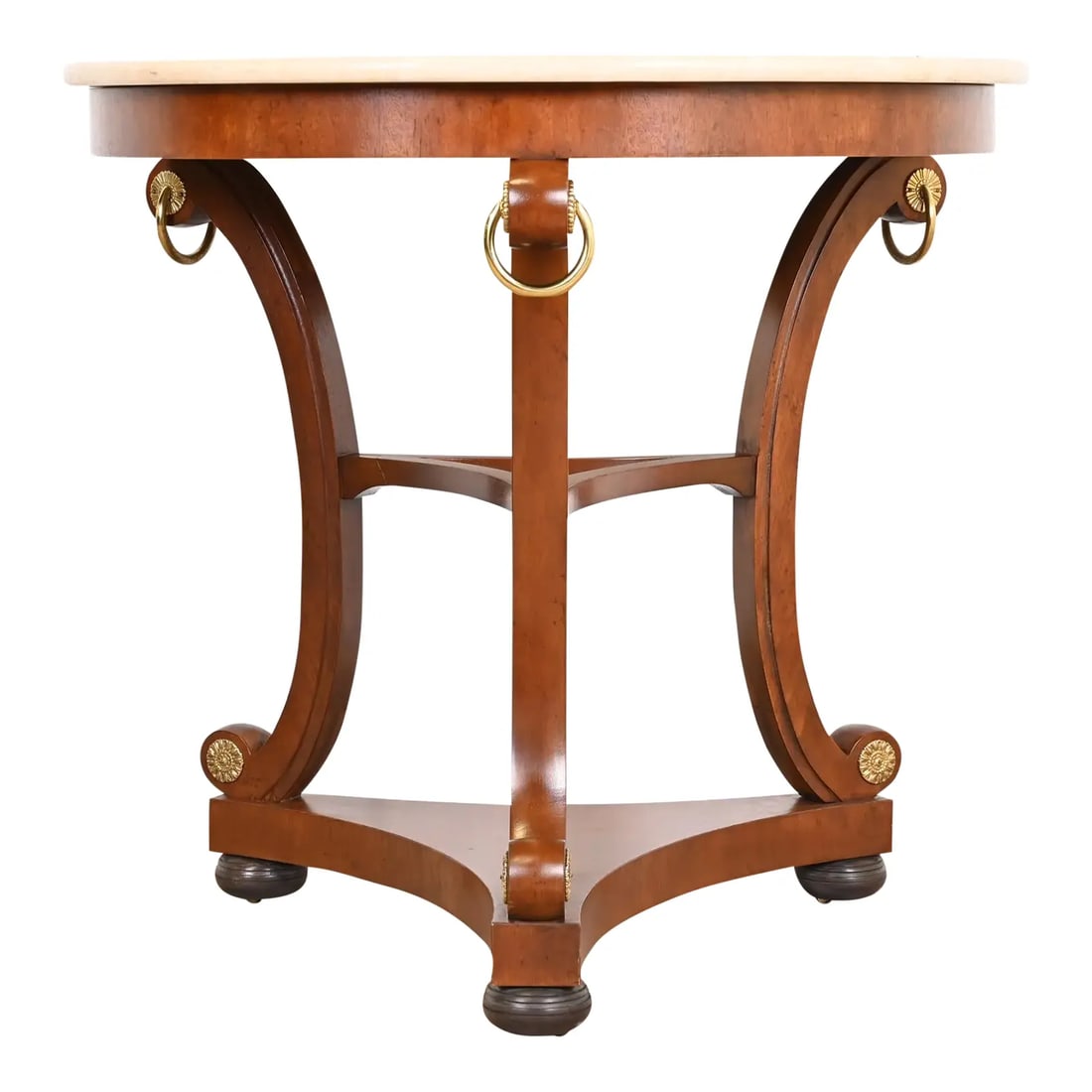 Baker Furniture Stately Homes Collection Regency Carved Mahogany Marble Top Center Table: An exceptional Regency or Empire style tea table or center table By Baker Furniture, "Stately Homes" Collection USA, Circa Late 20th Century Gorgeous carved mahogany, with brass rings and accents, and